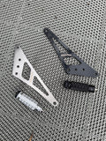Ultra Bee foot lock set with machined silver and black brackets and knurled pegs