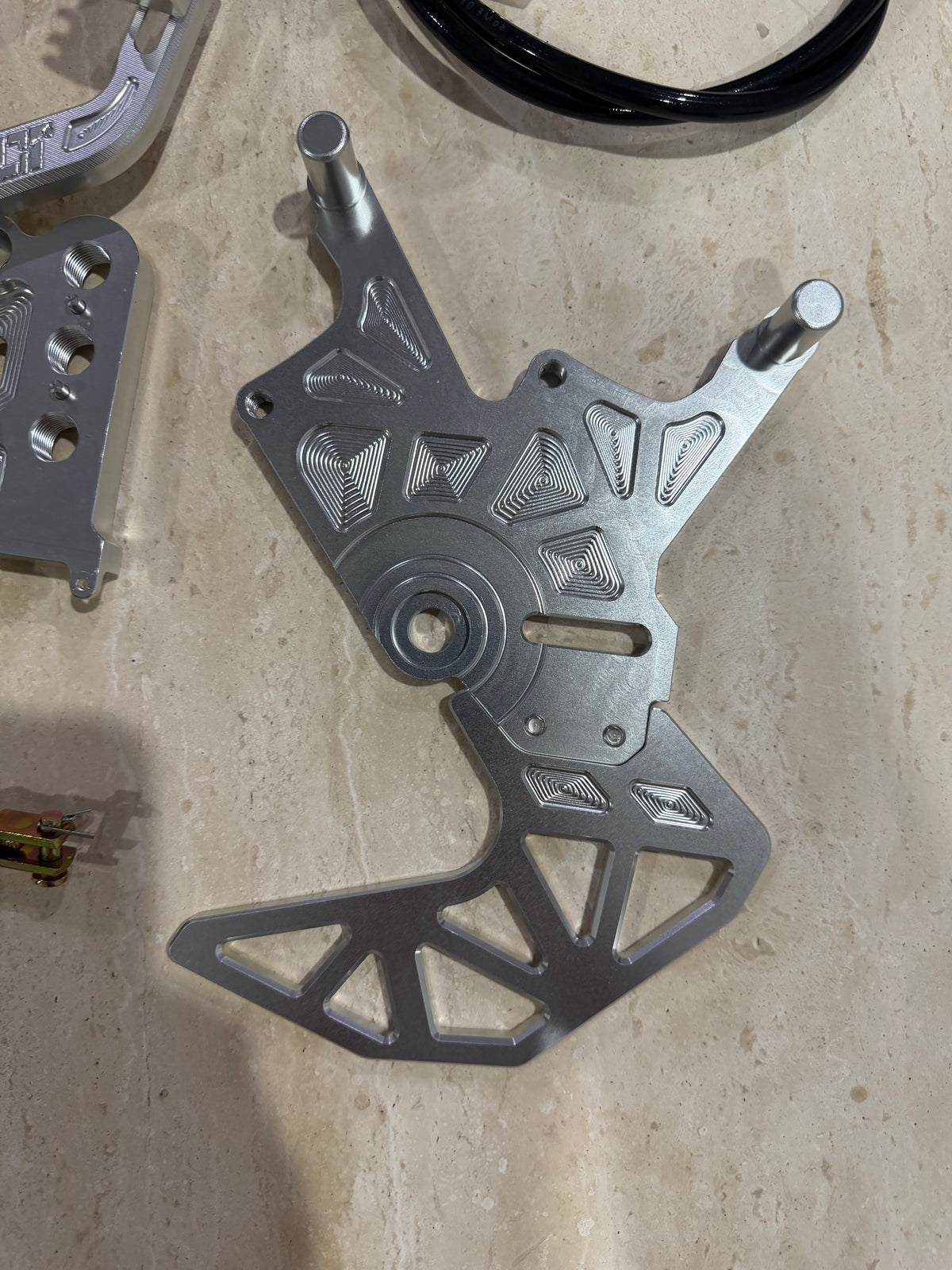 E-moto foot brake machined pedal bracket and rotor guard in raw aluminium finish