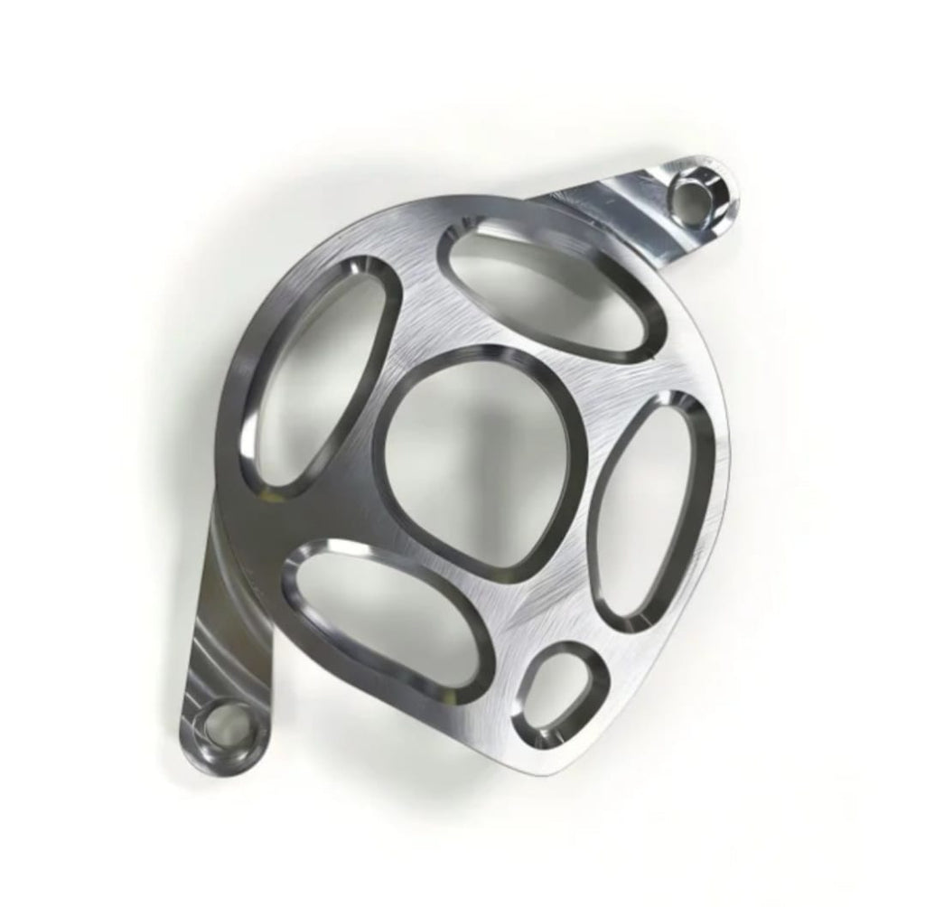 Metal motor cover for Surron LBX in polished raw aluminium with five-hole machined design