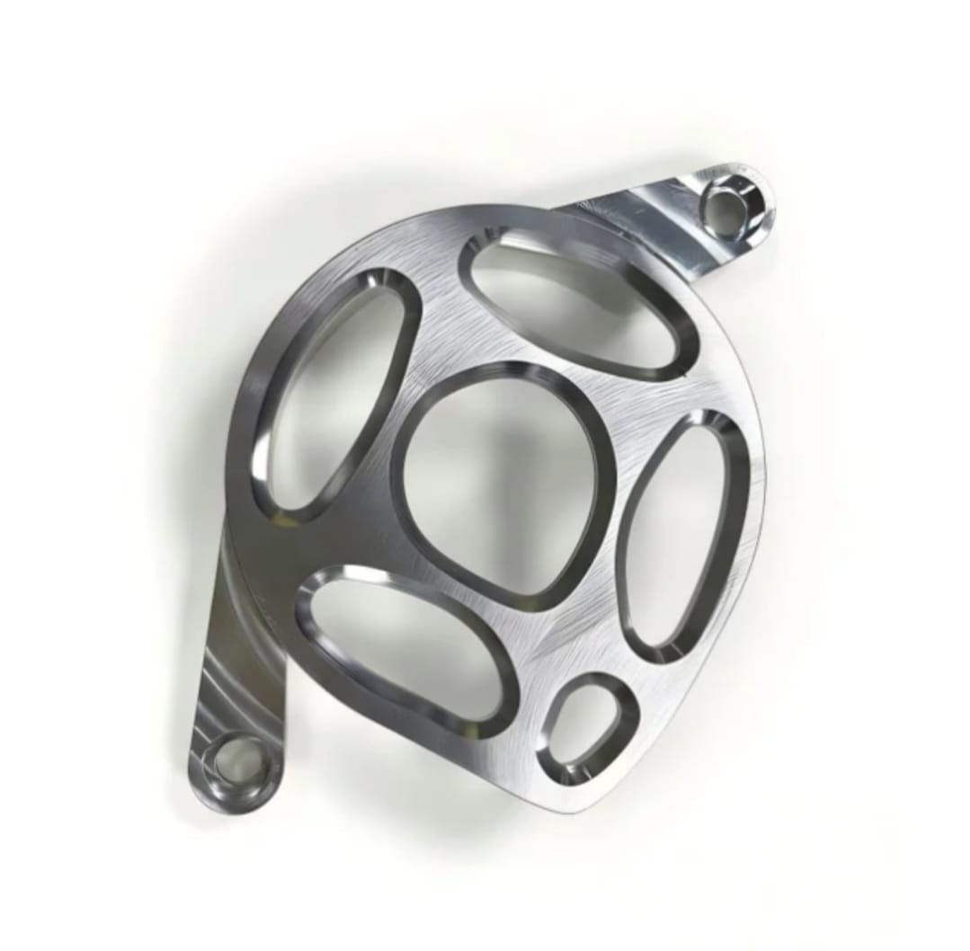 Metal motor cover for Surron LBX in polished raw aluminium with five-hole machined design