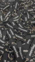 MXPartsAU rubber keychains in black with white branding, shown in a pile