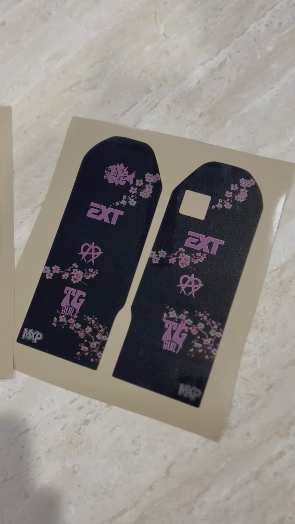 Talaria X3 cherry blossom fork decal pair in black with pink blossom artwork and EXT logo